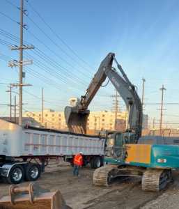 Excavation and Transportation Services: Truck loading contaminated soil