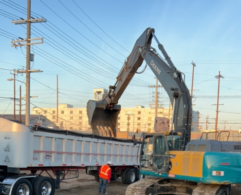 Excavation and Transportation Services: Truck loading contaminated soil